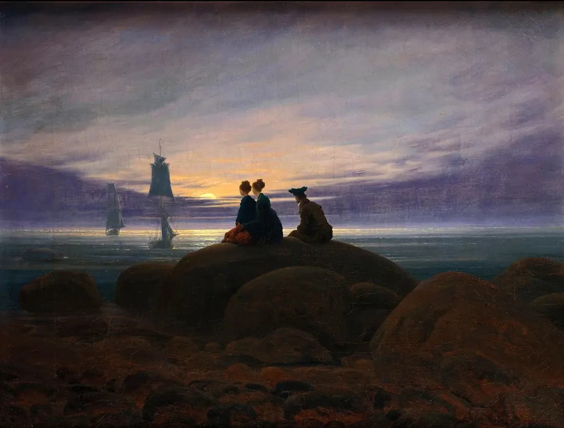 Three figures sit on a rocky shore as sailing ships approach beneath a rising moon