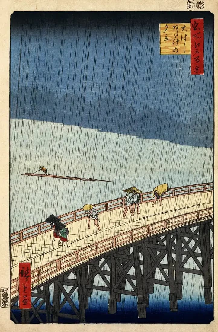 Travellers hurry across Shin-Ōhashi bridge beneath dense diagonal rain in a woodblock print by Hiroshige