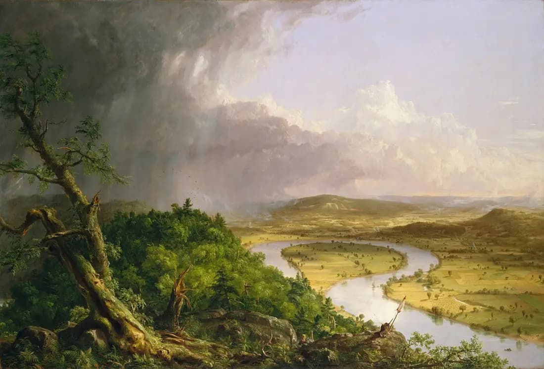 A storm clears over a broad bend in the Connecticut River, with wild forest at left and sunlit fields at right