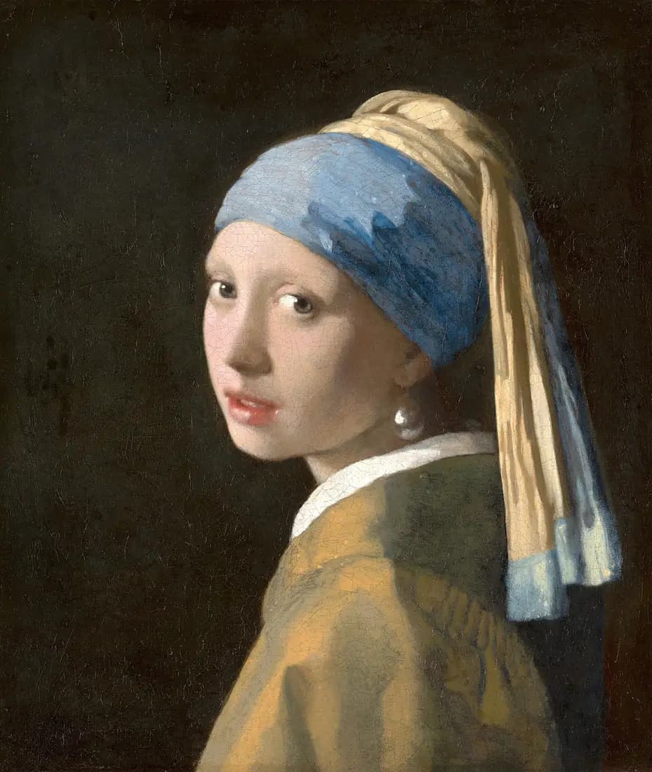 A young woman in a blue and yellow headscarf turns toward the viewer against a dark background